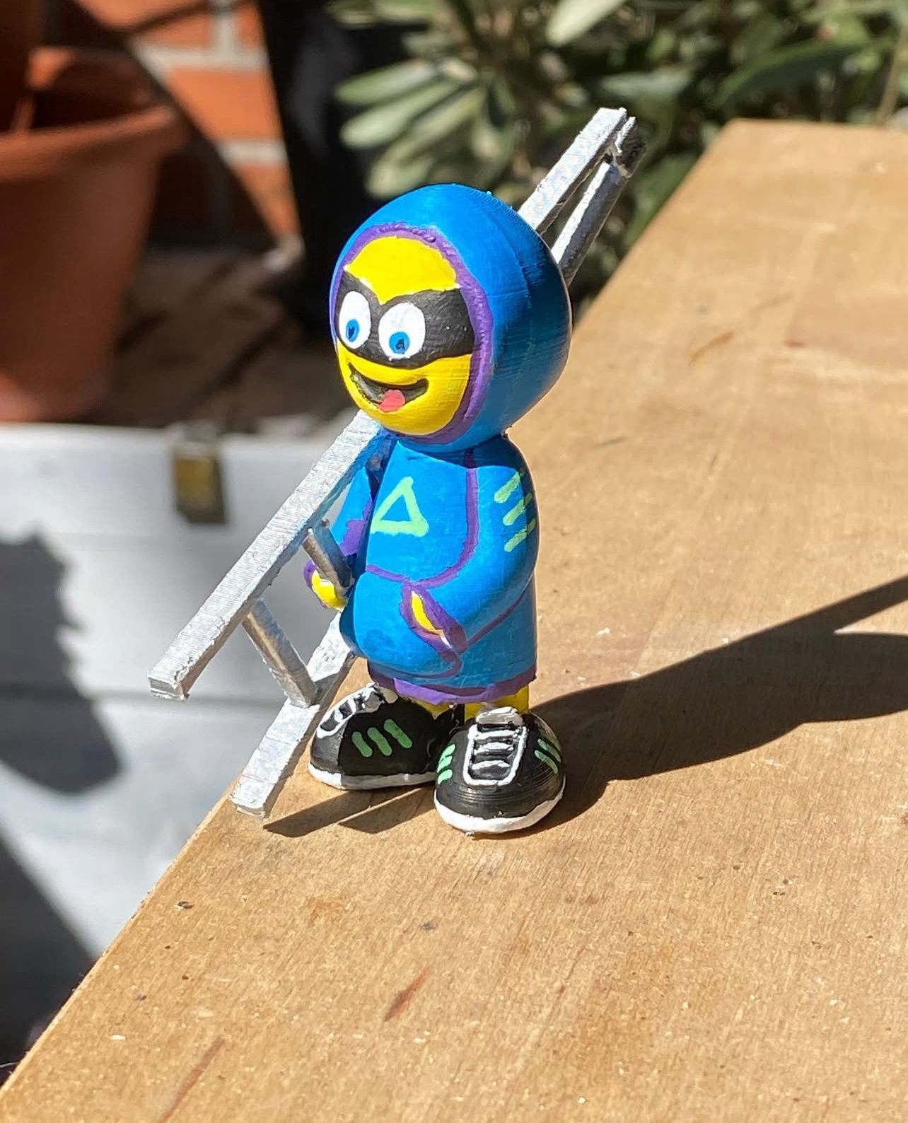 Kleine Figur mit Leiter